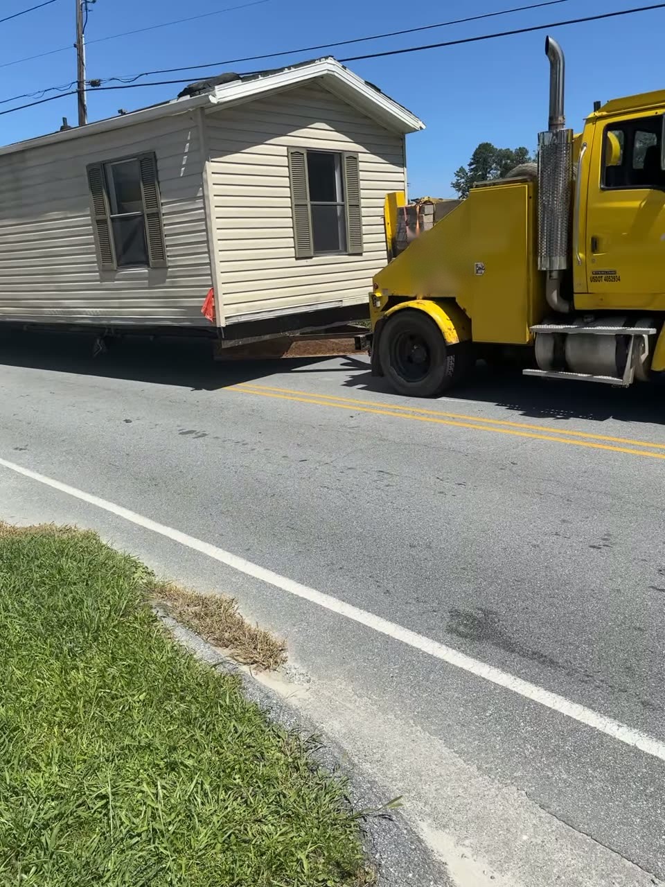 Our truck bringing a single-wide around the corner